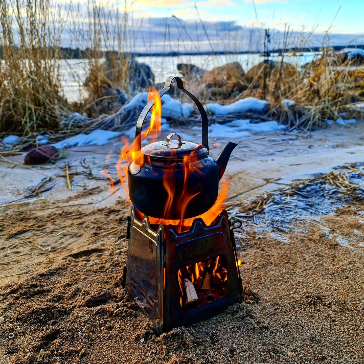 kettle over small campfire