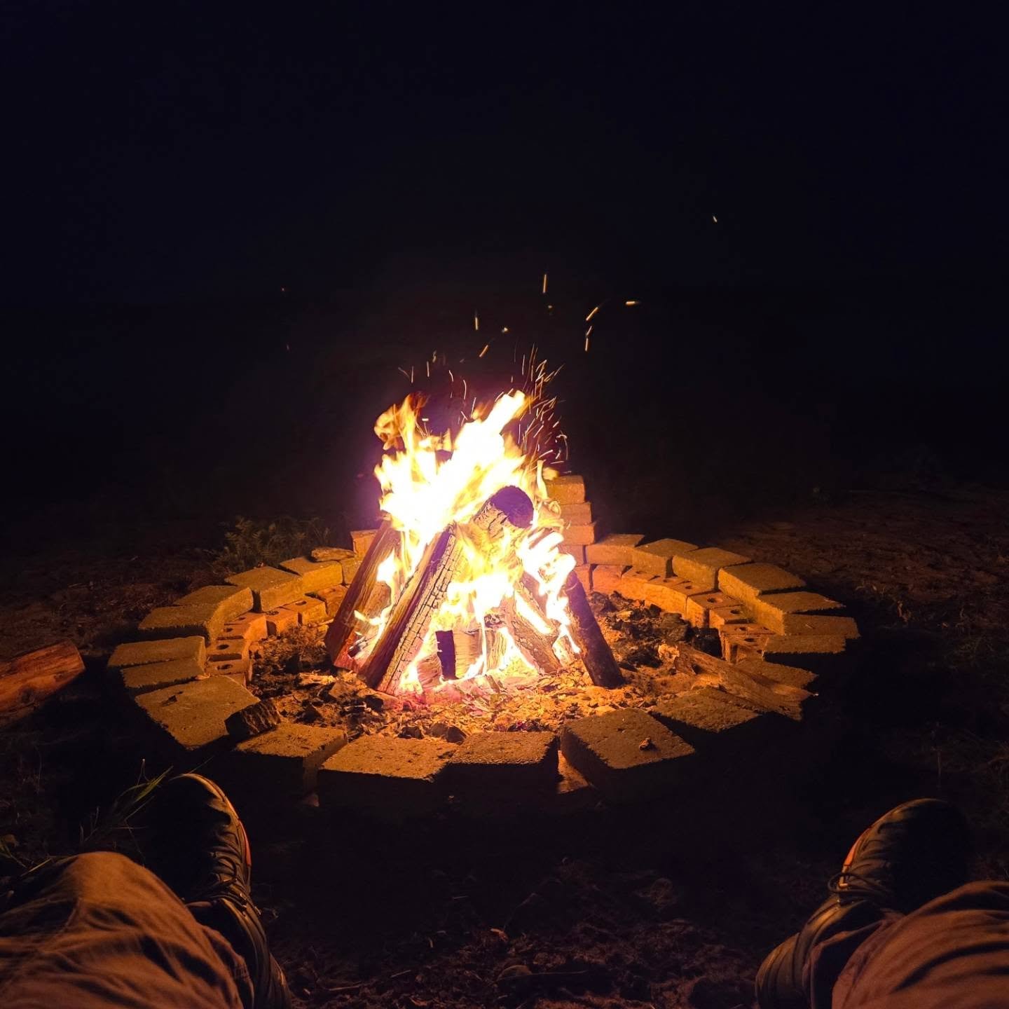 relaxing around campfire