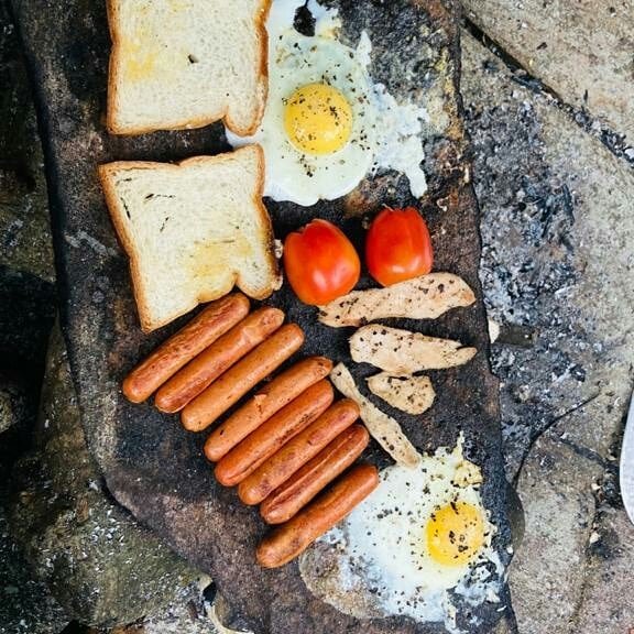 food cooking on rock