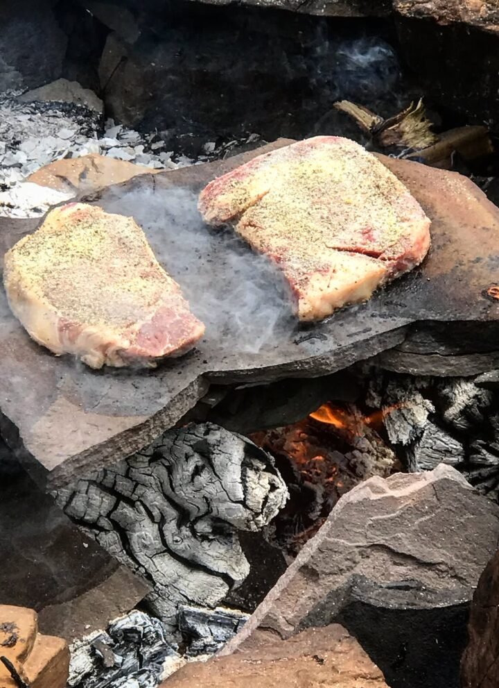 meat cooking over open fire