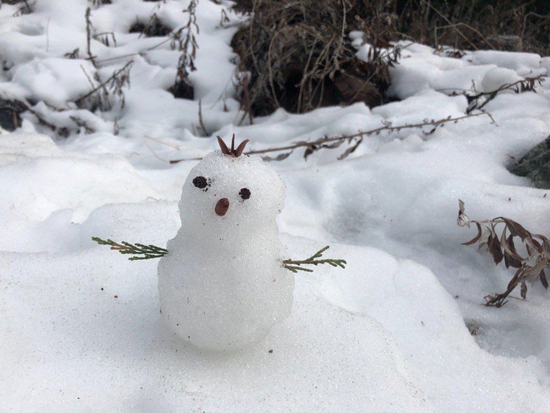 making snowman while camping