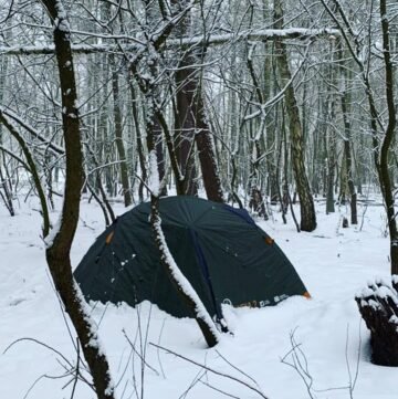 tent camping in woods in winter