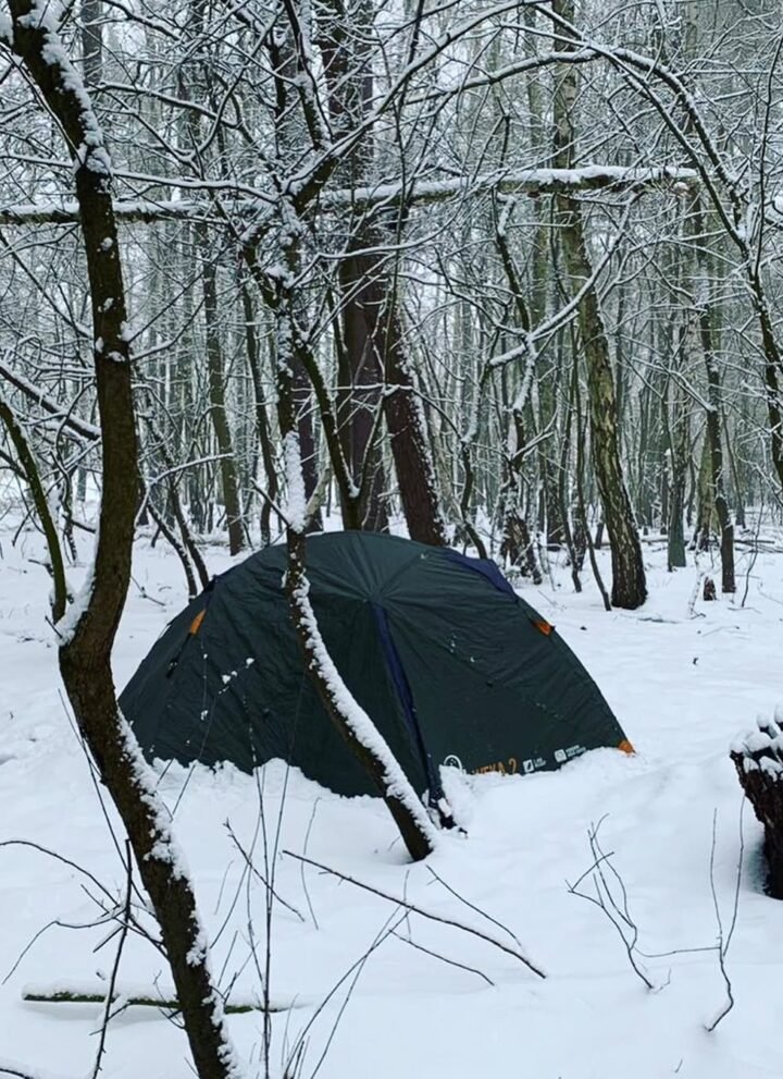 tent camping in woods in winter