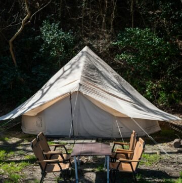 camping tent with wooden chairs